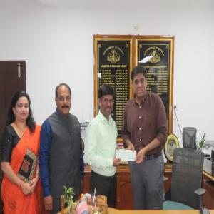 Chairperson hands over ₹50L DD to CMDRF for Wayanad to District Collector